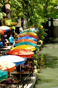 I love the colors of the umbrellas and all the ducks swimming by.